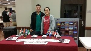 students posing at the CLC table