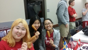 students posing with corndogs
