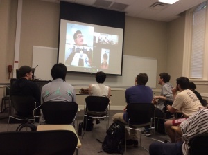 students in a class watching a video