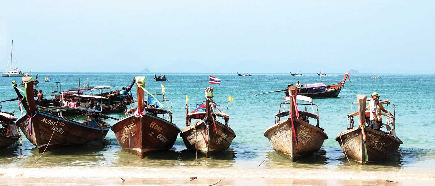 boats on a beach in Thailand