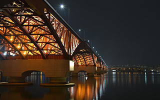 a bridge, viewed at night